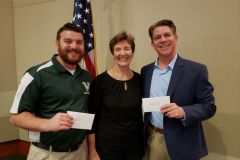 Venice Concert Band President Mary Deur presents $2,000 grant checks to Venice Middle School band director Ian Ackroyd for a bass drum, drum stand, and music supplies and Pine View Middle School band director Victor Mongillo for two clarinets and music supplies.  February 2020.