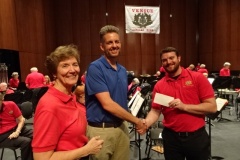 Venice Concert Band gives $2,500 grant to Venice High School band director Jonathan Case to be used for summer band camp scholarships.  Mary Deur, Jonathan Case, Ian Ackroyd.  April 2019