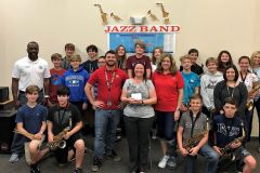 Angela McKenzie, center front, Laurel Nokomis Middle School band director, receives $1,200 grant for band music and instrumental supplies from Venice Concert Band members Ian Ackroyd and Lauren Maturo.  Pictured with Laurel Nokomis band students.  March 2018.