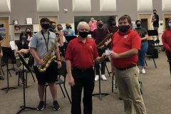 Russ Bullis, Venice Concert Band treasurer, gives $2,000 grant for a tenor saxophone to David Wing, director of the Venice High School band.  February 2021.